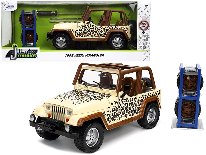 1992 Jeep Wrangler Tan and Brown with Graphics and Extra Wheels "Just Trucks" Series 1/24 Diecast Model Car by Jada